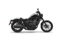 A black Honda Rebel CMX1100 DCT motorcycle is shown in profile against a white background. The cruiser class bike features a low seat, wide handlebars, and a robust engine with automatic transmission. It boasts a modern, minimalist design with sleek lines and a matte finish, including spoked wheels and disc brakes.