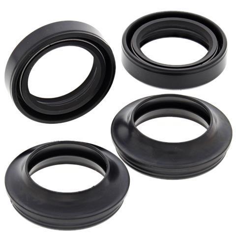 Four black, circular rubber seals in various orientations are pictured against a white background. They appear similar in size and design, with two seals shown at an angle and two presented flat, highlighting their ring-like structure and flexible material. These VERTEX FORK & DUST SEALS PAIR ALL BALLS H CB/CL/CA175 73 are designed for Honda CB/CL/CA175 models.
