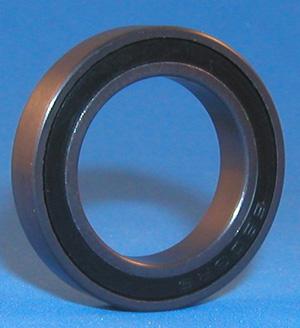 A single 454 BALL BEARING NSK 62042RS with a black inner ring is standing upright against a blue background. The bearing appears to be cylindrical with a smooth surface.