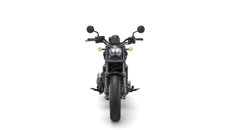 A black Honda Rebel CMX1100 DCT motorcycle is shown in profile against a white background. The cruiser class bike features a low seat, wide handlebars, and a robust engine with automatic transmission. It boasts a modern, minimalist design with sleek lines and a matte finish, including spoked wheels and disc brakes.