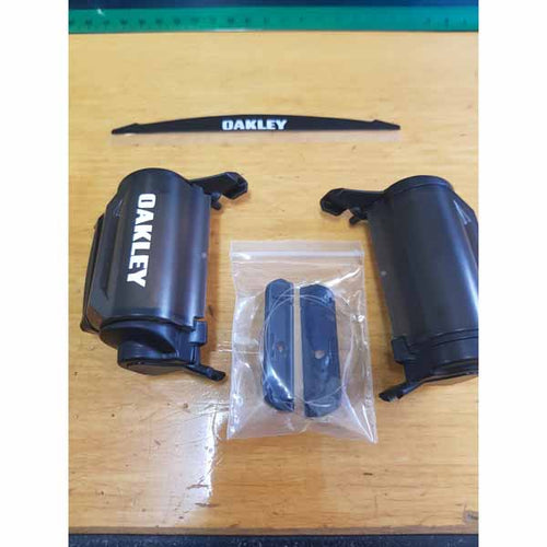 The parts that make up the OA-100-258-001 Oakley Airbrake Single Roll-Off Accessory Kit - clear lens is not included