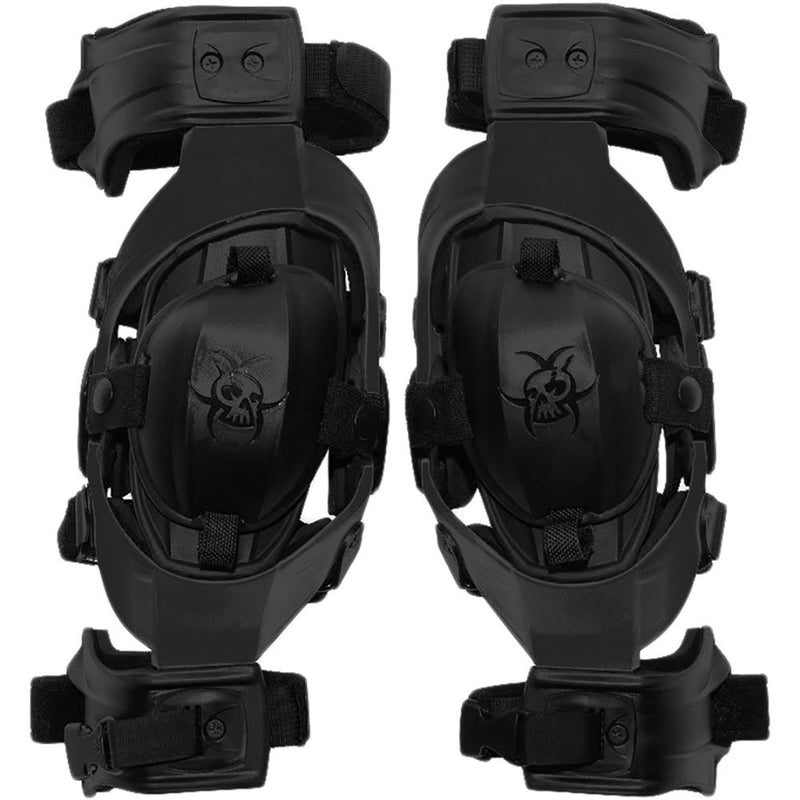 A pair of black KNEE BRACES ASTERISK JUNIOR CELL FOR DIRTBIKE RIDERS with adjustable straps and padding for support and protection. Each brace features a skeletal design logo on the front, part of the ASTERISK Junior Cell knee protection system.