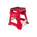 Introducing the RTECH R15 Works Cross Bike Stand Launch Edition Red, crafted with bright red injection-molded plastic and a black non-slip top surface. It includes a convenient handle cutout for easy carrying and is reinforced with metal braces for enhanced stability, making it suitable for tasks requiring extra height. Plus, it offers optional customizable graphic panels.