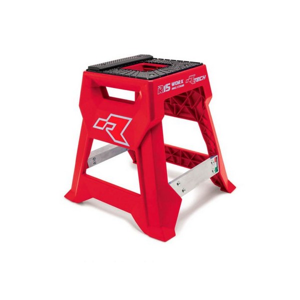 Introducing the RTECH R15 Works Cross Bike Stand Launch Edition Red, crafted with bright red injection-molded plastic and a black non-slip top surface. It includes a convenient handle cutout for easy carrying and is reinforced with metal braces for enhanced stability, making it suitable for tasks requiring extra height. Plus, it offers optional customizable graphic panels.