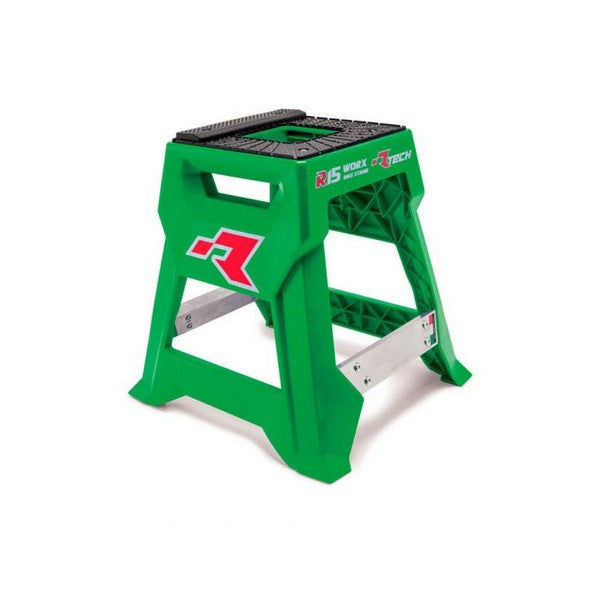 The RTECH R15 Works Cross Bike Stand Launch Edition in green, crafted from sturdy plastic with a black accent, features reinforced sides for added stability and a carry handle on top. This versatile piece doubles as a step stool and proudly displays the RTECH logo, indicating its suitability for heavy-duty work.