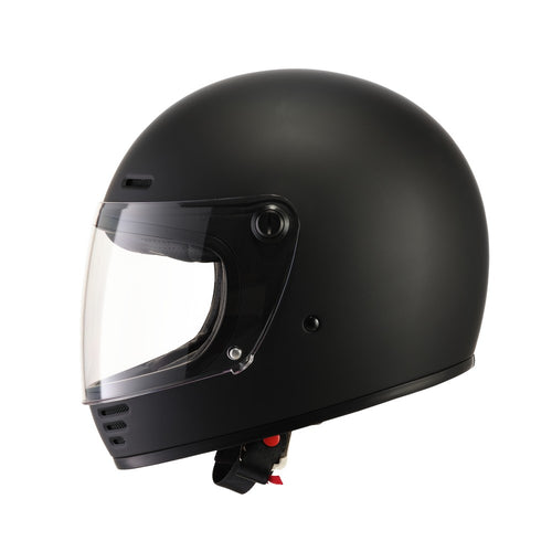 A black ELDORADO E70 RETRO DESIGN MATT BLACK helmet with a clear visor is shown on a white background. The full-face motorcycle helmet features ventilation slots at the top and front, boasting a solid, streamlined design. The visor is in a slightly raised position, revealing a padded interior and removable liner.