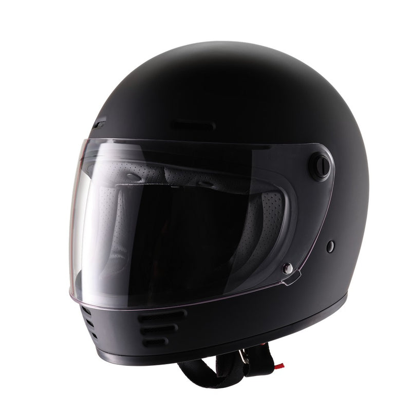 A black ELDORADO E70 RETRO DESIGN MATT BLACK helmet with a clear visor is shown on a white background. The full-face motorcycle helmet features ventilation slots at the top and front, boasting a solid, streamlined design. The visor is in a slightly raised position, revealing a padded interior and removable liner.