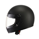 A black ELDORADO E70 RETRO DESIGN MATT BLACK helmet with a clear visor is shown on a white background. The full-face motorcycle helmet features ventilation slots at the top and front, boasting a solid, streamlined design. The visor is in a slightly raised position, revealing a padded interior and removable liner.