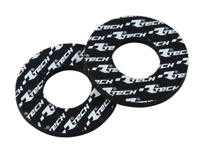 The HANDLEBAR GRIP DOUNT RTECH ANTI BLISTER grips, branded by RTECH, come in pairs and feature black foam construction with white "R TECH" logos. These grips have circular openings designed for easy installation on bicycle or motorcycle handlebars, providing enhanced grip and comfort.