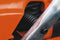 A Husqvarna 120 Mark II Chainsaw with an orange body and a silver blade is shown. The word "Husqvarna" is printed on the side of the blade. Positioned at a slight angle, it highlights its ergonomic handle and design, making it perfect for maintaining lawns and garden tasks efficiently.