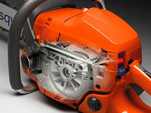 An advertisement for Husqvarna featuring an orange and grey Husqvarna T540 XP® II Chainsaw with the 