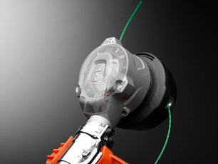 An image of a 2021 Husqvarna 520iLX Battery Grass Trimmer - Skin Only, featuring a head with a dual-line cutting system and an ergonomic handle. The motor and battery compartment are located at the rear end, showcasing its power and efficiency, with the device positioned horizontally against a plain white background.