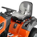 A Husqvarna TS242TXD Ride-On Mower is shown in bright orange, featuring a comfortable gray seat with armrests, large textured tires, and a robust ClearCut™ deck underneath. The side discharge tractor boasts a modern design with the prominent Husqvarna logo on its front.