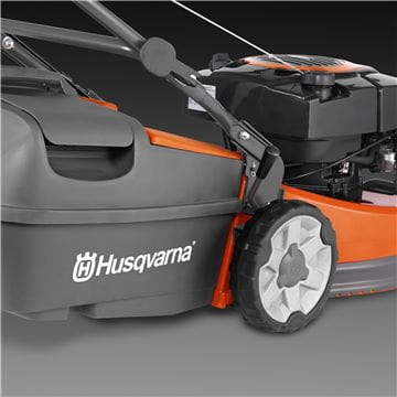 An orange and black Husqvarna LC419A Lawn Mower with a grass collection bag on the rear. Perfect for any outdoors enthusiast, this power tool features a push handle, four wheels, and a metal cutting deck. The Husqvarna logo is prominently displayed on the side of the bag.