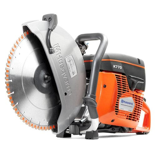 The **Husqvarna K770 Power cutter** featuring an orange and black body with a large circular blade, designed for heavy-duty cutting tasks often required in forestry. The saw has ergonomic handles, a partially covered blade by a silver guard, and the prominent **Husqvarna** logo visible. Perfect for outdoor use.