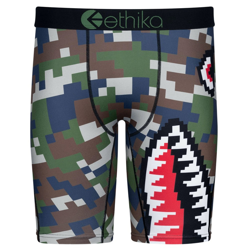 The Ethika Mens Bomber Digi Staple Fit boxer briefs by Ethika showcase a digital camouflage pattern in green, brown, and dark blue tones. The design prominently features a large pixelated shark mouth graphic that extends from the front to the side. These boxer briefs come with a high-quality jacquard waistband and offer an unmatched staple fit with 4-way stretch fabric.