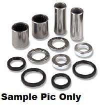A collection of metal and rubber cylindrical bushings, washers, and seals is displayed. The VERTEX SWINGARM BEARING KIT INCLUDES GREASE for Honda CRF150F 03-21 rear suspension includes four cylindrical metal bushings and eight various shaped washers and seals. The image is labeled "Sample Pic Only.