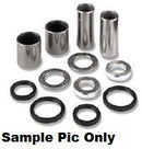 A collection of metal and rubber cylindrical bushings, washers, and seals is displayed. The VERTEX SWINGARM BEARING KIT INCLUDES GREASE for Honda CRF150F 03-21 rear suspension includes four cylindrical metal bushings and eight various shaped washers and seals. The image is labeled "Sample Pic Only.