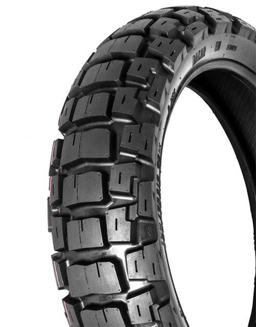 Close-up image of a rugged motorcycle tire with a large, knobby tread pattern designed for off-road use. The MOTOZ TYRE 150/70-18 MOTOZ TRACTIONATOR ADVENTURE has distinct, large rectangular rubber blocks that provide exceptional off-road traction on rough and uneven terrain. The sidewall has some imprinted text.