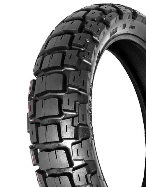 Close-up image of a rugged motorcycle tire with a large, knobby tread pattern designed for off-road use. The MOTOZ TYRE 150/70-18 MOTOZ TRACTIONATOR ADVENTURE has distinct, large rectangular rubber blocks that provide exceptional off-road traction on rough and uneven terrain. The sidewall has some imprinted text.