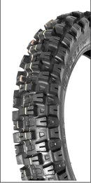 A close-up view of a 110 90 19 MOTOZ TYRE ARENA HYBRID - FOR ENDURO CROSS EXTREME ENDURO TECHNICAL CLOSED CIRCUIT EVENTS on an off-road motorcycle, showcasing its rugged tread pattern designed for optimal traction on diverse terrains. The tire features deep grooves and robust knobs for enhanced durability and performance, perfect for Extreme Enduro adventures.