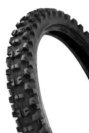 A close-up of the rugged MOTOZ TYRE 70/100-19 TPS off-road tire features deep angular treads designed for exceptional traction. Positioned at an angle against a plain white background, it highlights its textured surface and robust build.