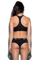 The ETHIKA WOMENS MIDNIGHT BLACK SPORTS BRA features racer back straps and a double-layered design, with a bottom band showcasing the "Ethika" brand name in white text, underlined by a partial white arc enclosing the initial "e.