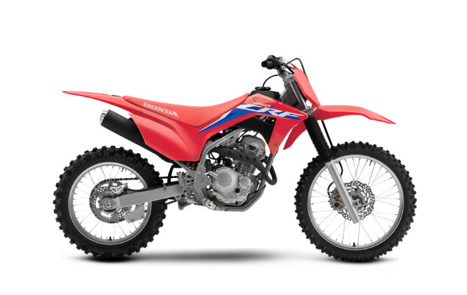 A Honda CRF250F dirt bike, in a striking red color with blue and white accents, viewed from the side. This Honda model boasts knobby tires for off-road trails, a robust frame construction, and an exposed fuel-injected engine. Its sleek, sporty design is optimized for high performance and tackling rugged terrain.