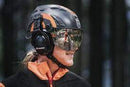 The Husqvarna Spire Arborist Helmet is a grey and orange helmet featuring a prominent "H" logo on the front. It is designed for professional arborists, equipped with black adjustable straps, a chin strap for secure fitting, and a Spire Vent system that ensures protection in various hazardous work environments.