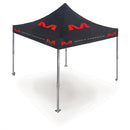 A black pop-up tent with a pointed roof bears red "M" logos on each side. Labeled in bold white text as "Crown Kiwi Enterprises Limited," this MATRIX Aluminium Pop-Up Tent Complete is weather-resistant and features an HD hex aluminum frame with four sleek silver legs, all set against a crisp white backdrop.