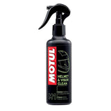 A black spray bottle labeled "Motul Helmet & Visor Cleaner 250ml" with a red and white Motul logo. The bottle features an image of a helmet and text indicating it cleans helmet exteriors, visors, and MX goggles. The bottle is equipped with a trigger spray nozzle.
