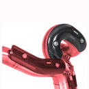 Close-up of a bicycle handlebar featuring bright red bar tape and black, textured grips with two reflective bolts. The ergonomically designed grips appear to be constructed of carbon fiber, adding a sleek, modern look reminiscent of high-performance parts like the Akrapovic Heat Shield CA from AKRAPOVIC.
