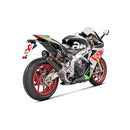A sleek Akrapovic Muffler Aprilia RSV4/Tuono in black and silver, featuring the AKRAPOVIC brand's logo prominently displayed. This slip-on exhaust system boasts a carbon fiber texture and a curved metal connector, making it ideal for Aprilia motorcycles. The background is plain white.