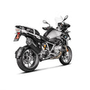 The Akrapovic Slip-On Muffler for BMW R1250GS sports a sleek silver and black design with a tapered end and mounting bracket, emblazoned with the white AKRAPOVIC logo. It enhances performance while delivering the iconic Akrapovič sound.