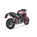 The Akrapovic Slip On BMW F900R/XR 2020-23 exhaust boasts a sleek metallic design with a rectangular carbon fiber-trimmed end, featuring a red logo on its black segment. Set diagonally against a white backdrop, it beautifully captures the signature AKRAPOVIC sound.
