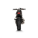 The Akrapovic Ducati Scrambler 2021-22 dual exhaust system, by AKRAPOVIC, features a sleek design with metallic pipes and black cans decorated with a logo. Made from stainless steel, the circular tips offer a polished and modern look.