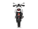 The Akrapovic Ducati Desert-X 2023 features a sleek metallic titanium exhaust pipe with a carbon fiber tip and heat shield. The AKRAPOVIC logo is prominently displayed, boasting an aerodynamic muffler design that enhances performance and aesthetics.