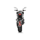 Introducing the Akrapovic Slip On Honda CB1000R 2018-23, a titanium AKRAPOVIC motorcycle exhaust system with a sleek, cylindrical design. This exhaust showcases a shiny silver finish, a carbon-fiber end cap, and prominently displays the AKRAPOVIC logo on the side. Experience the racing sound that amplifies your ride’s thrill.