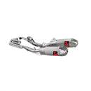 The white background accentuates the Akrapovic Full Ti System CRF250R 18-21's shiny metallic finish. Two silver titanium exhaust pipes, adorned with AKRAPOVIC red and black logos, connect to curved tubes. Ideal for motorcycle racing enthusiasts craving performance and sleek design.