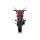 Close-up of the Akrapovic Slip On Muffler for CB400/500 CBR: a sleek, metallic exhaust pipe with a carbon fiber muffler featuring silver ends. The AKRAPOVIC logo in red and yellow enhances its iconic sound. A soft white background highlights its elegant design.