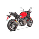 The Akrapovic Slip On Muffler for Honda CBR500 features a silver exhaust with a carbon tip, delivering the signature Akrapovič sound and displaying the AKRAPOVIC red and yellow logo on the side.