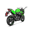 A black AKRAPOVIC Slip-On Muffler for the Ninja 250/400, showcasing the red logo and carbon fiber finish, rests on a white background. Its sleek design produces Akrapovič's iconic sound with a refined metal tip.