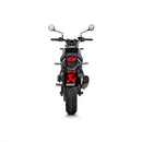 The Akrapovic Slip On Muffler Z650RS 2022-23 features a titanium muffler with a silver finish and black tip. "AKRAPOVIC" is visible on the side. Made from race-proven materials to boost power and torque, it includes mounting brackets in a cylindrical design against a white background.