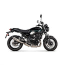 The Akrapovic Slip On Muffler Z650RS 2022-23 features a titanium muffler with a silver finish and black tip. "AKRAPOVIC" is visible on the side. Made from race-proven materials to boost power and torque, it includes mounting brackets in a cylindrical design against a white background.