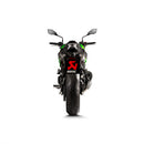 The Akrapovic Slip On Muffler Z900 20-23 by AKRAPOVIC is a high-performance motorcycle exhaust designed specifically for the Z900, featuring a carbon fibre finish and metallic components. The logo is prominently displayed in yellow and red on the body of the exhaust. The design is sleek, aerodynamic, and perfectly complements the naked and sporty aesthetic of the bike.