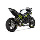 The AKRAPOVIC Slip On Muffler for the Z900A2 (2020-21) is a sleek black exhaust pipe made of lightweight carbon fiber, featuring a silver tip and curved end, with the iconic red and yellow Akrapovič logo on its side, designed to enhance motorcycle performance.