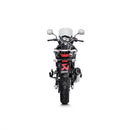 A sleek AKRAPOVIC Slip On V-Strom 650 17-23 with a silver metallic finish and carbon fiber tip features its logo on the curvy titanium muffler, set against a plain white background.