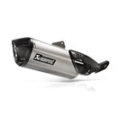 The Akrapovic Slip On Muffler V-Strom 800DE features a sleek, metallic design with a titanium outer sleeve and carbon fiber accents on a white backdrop. "AKRAPOVIC" branding is visible, highlighting its aerodynamic finish that enhances the signature Akrapovič sound.