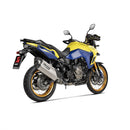 The Akrapovic Slip On Muffler V-Strom 800DE features a sleek, metallic design with a titanium outer sleeve and carbon fiber accents on a white backdrop. "AKRAPOVIC" branding is visible, highlighting its aerodynamic finish that enhances the signature Akrapovič sound.