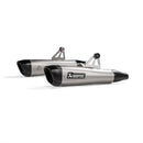 The Akrapovic Slip On Bonneville T120 16-20 exhaust features two metallic pipes with black tips and the AKRAPOVIC logo, enhancing sound. Designed for motorcycles, they include mounting brackets and are parallel against a white background, showcasing sleek precision.